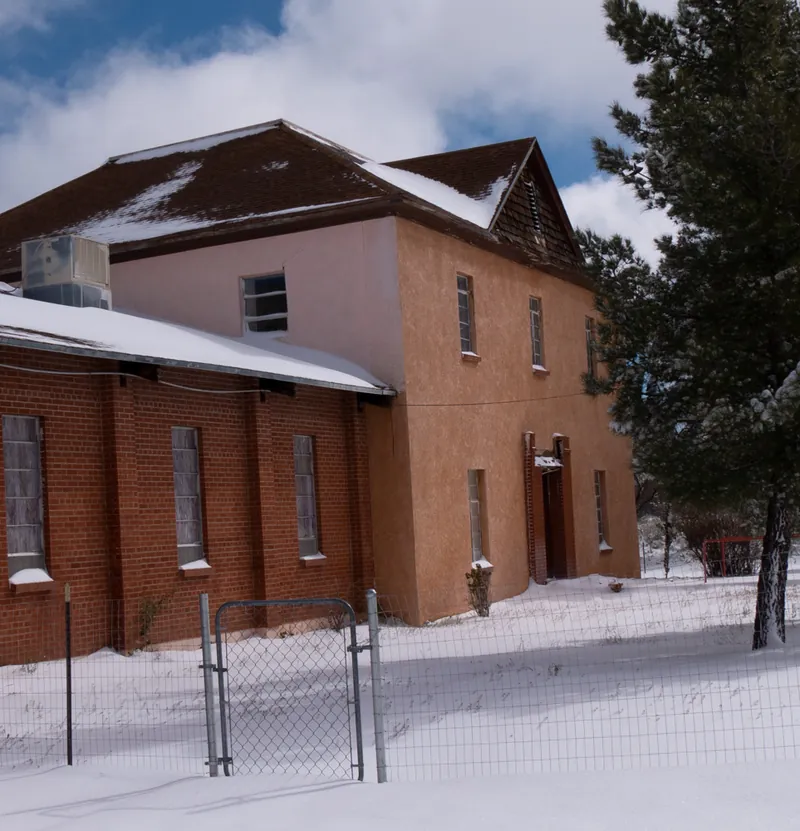 The original 1895 block of the Mountain View Hotel as it stands today, under snow.
